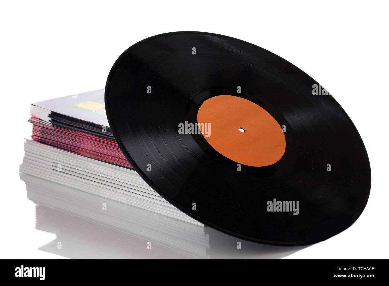 Black vinyl record and stack of magazines isolated on white Stock Photo ...