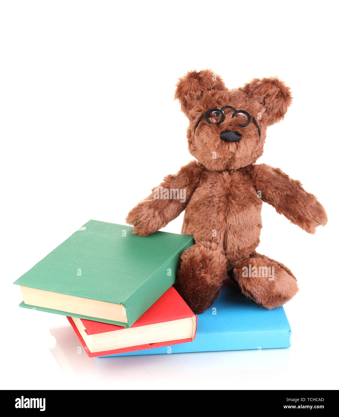 Sitting bear toy with books isolated on white Stock Photo - Alamy