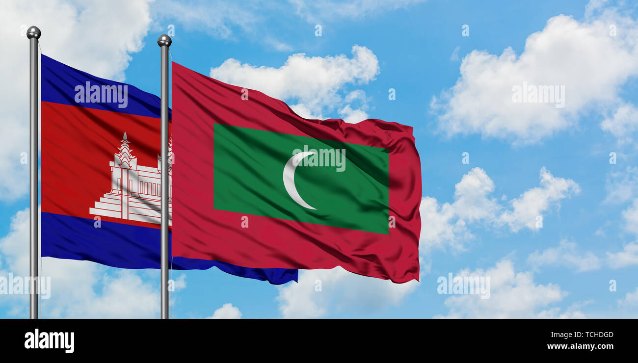 Cambodia and Maldives flag waving in the wind against white cloudy blue sky together. Diplomacy concept, international relations. Stock Photo