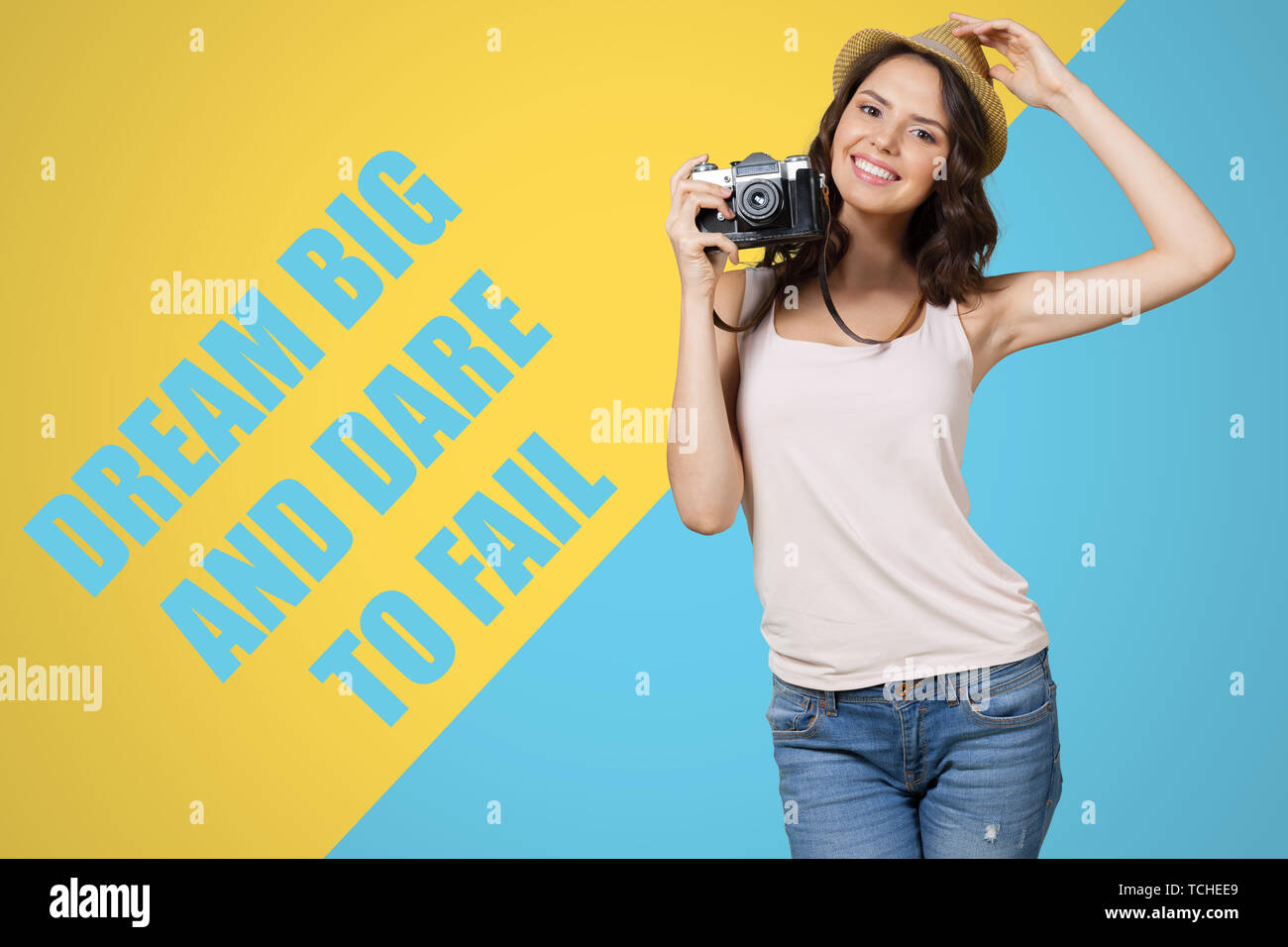 Cheerful female photographer posing for camera Stock Photo - Alamy