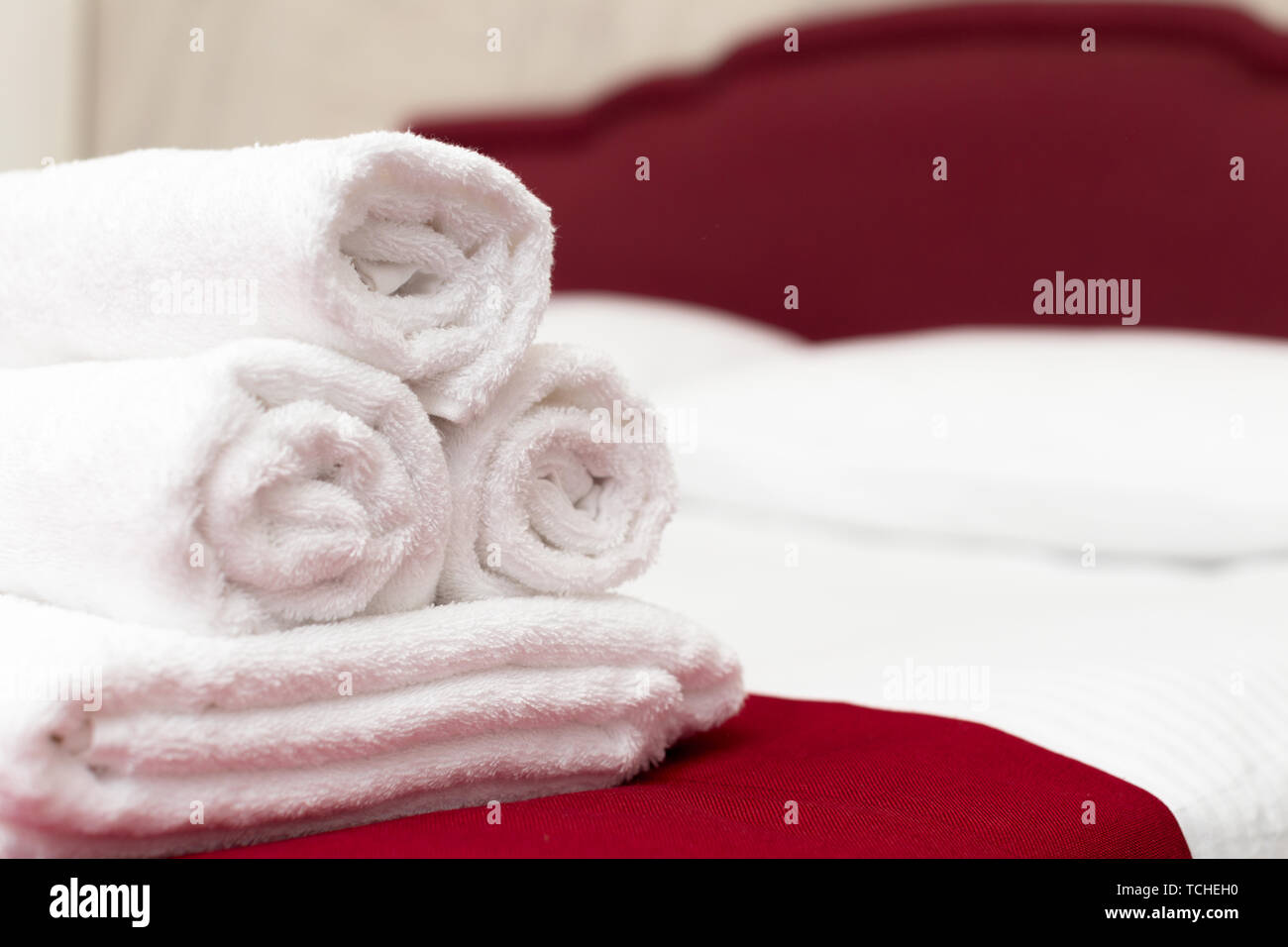 Clean towels on bed at hotel room Stock Photo - Alamy