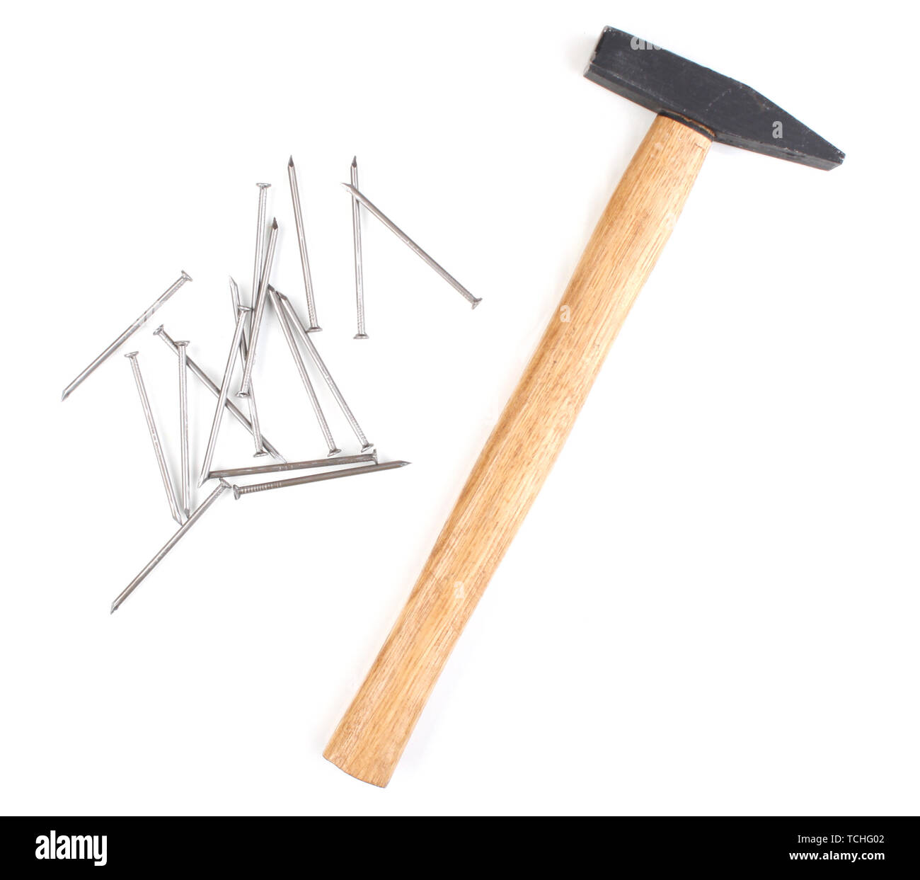 Hammer and metal nails isolated on white Stock Photo - Alamy