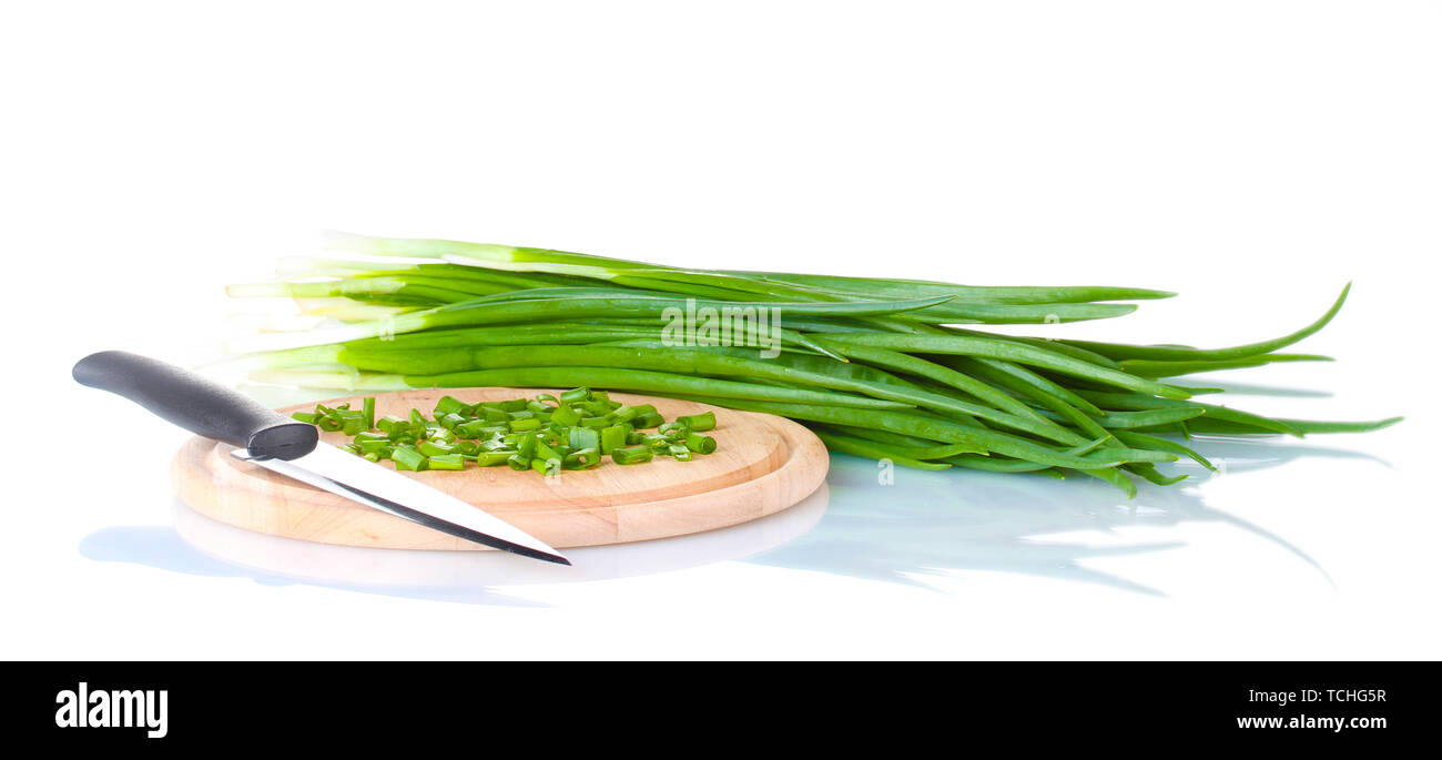 Green onion on a cutting board with knife isolated on white Stock Photo ...