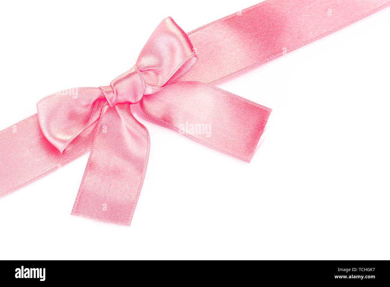 beautiful pink satin bow and ribbon isolated on white Stock Photo - Alamy
