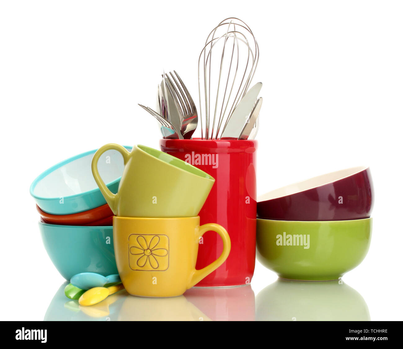 bright empty bowls, cups and kitchen utensils isolated on white Stock Photo