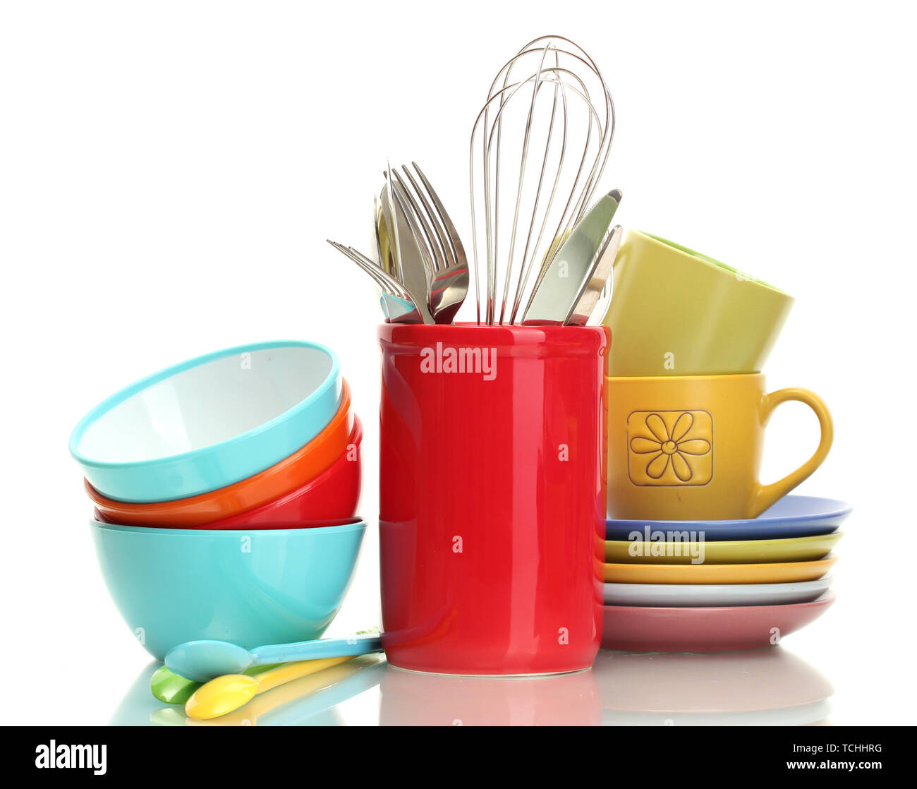 bright empty bowls, cups and kitchen utensils isolated on white Stock Photo