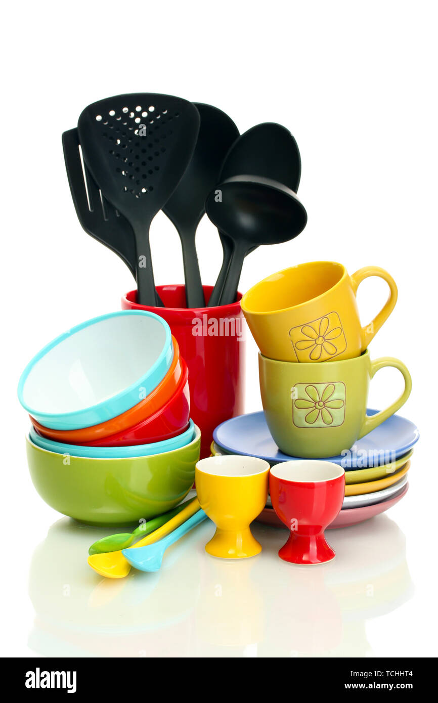 bright empty bowls, cups and kitchen utensils isolated on white Stock Photo