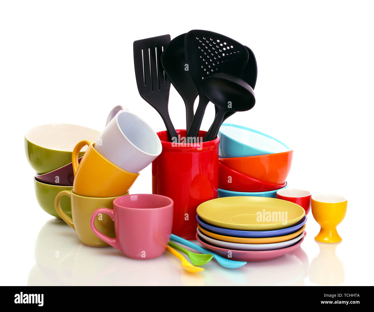 bright empty bowls, cups and kitchen utensils isolated on white Stock Photo