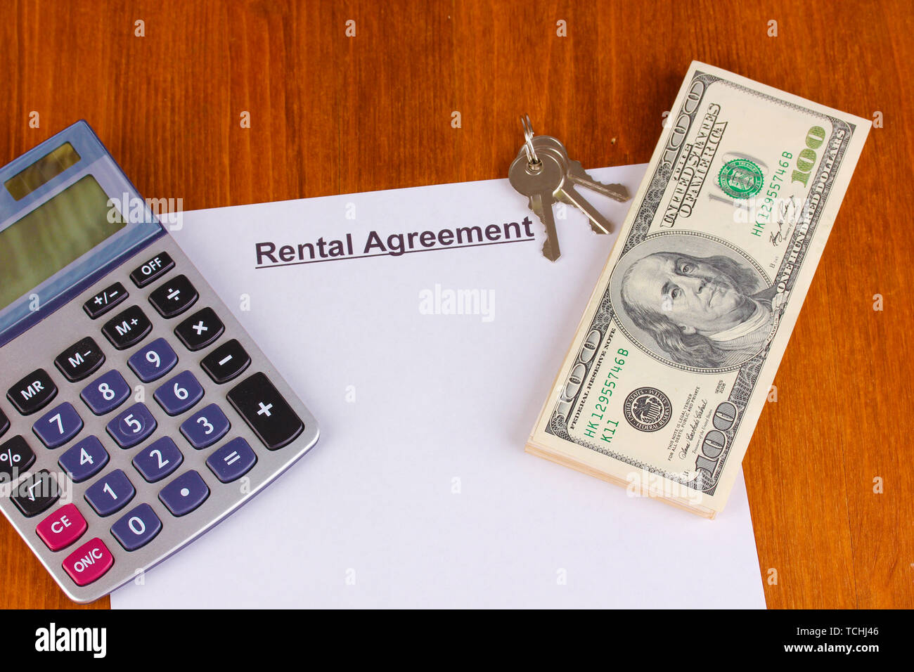 Rental agreement with dollars on wooden background close-up Stock Photo ...