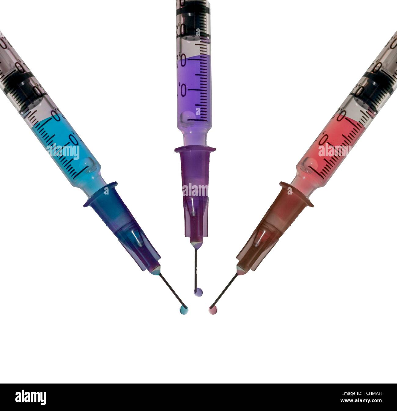Hypodermic syringes filled with colourful liquid Stock Photo