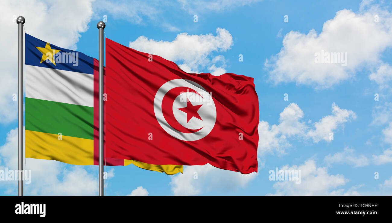 Central African Republic and Tunisia flag waving in the wind against white cloudy blue sky together. Diplomacy concept, international relations. Stock Photo