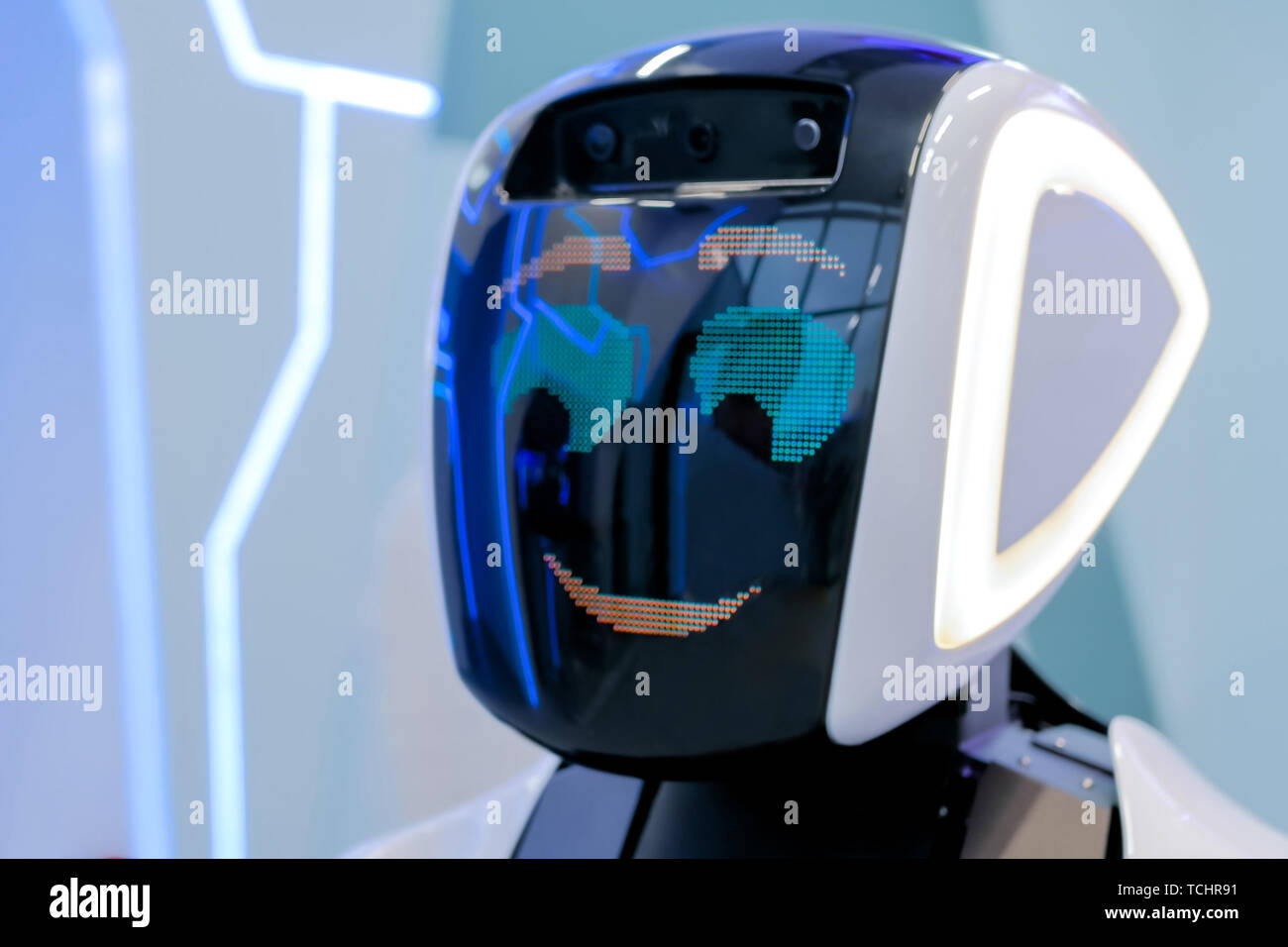 White shy robot with display face at robotic show Stock Photo - Alamy