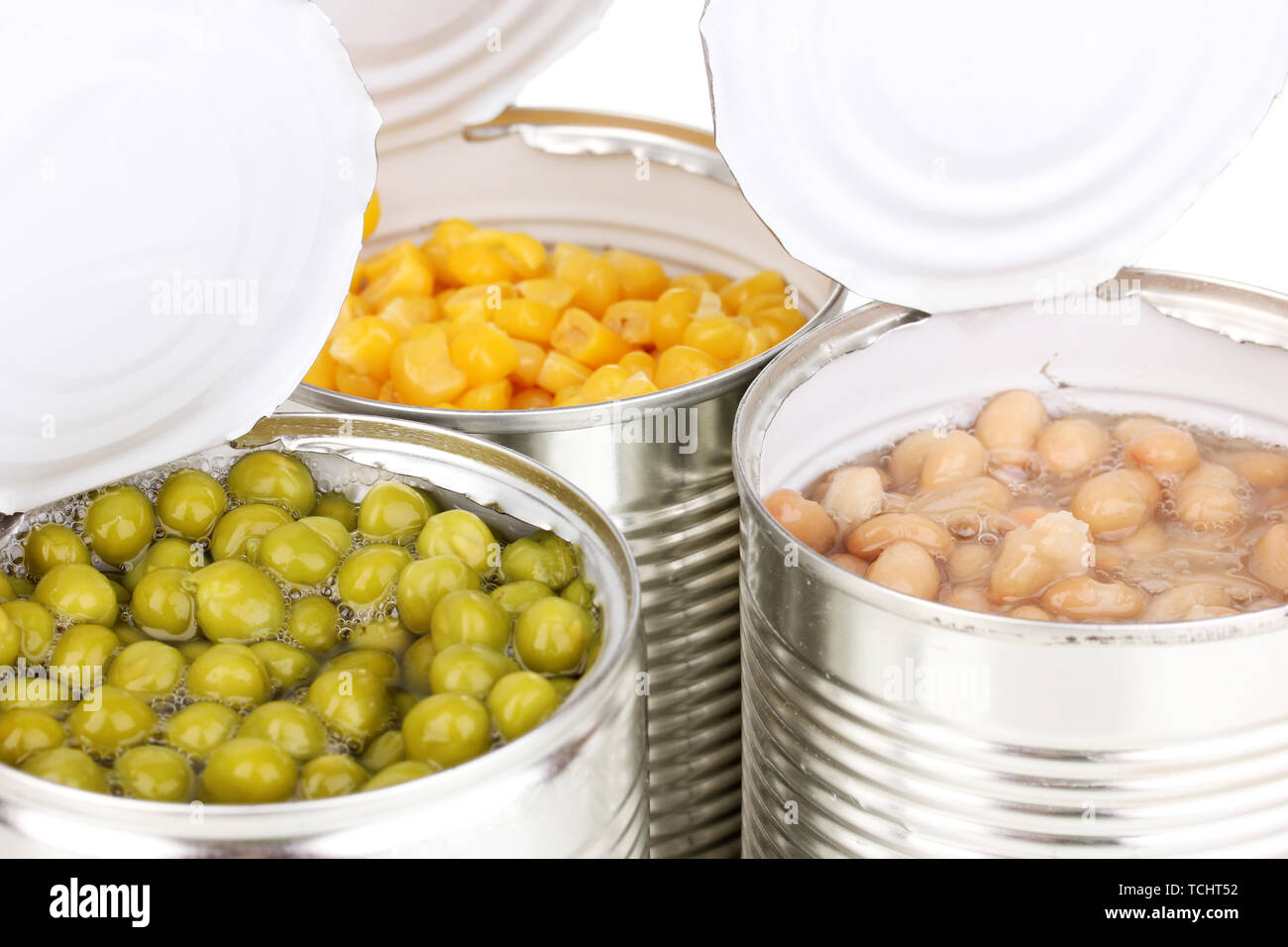 Open tin cans of corn, beans and peas isolated on white Stock Photo Alamy