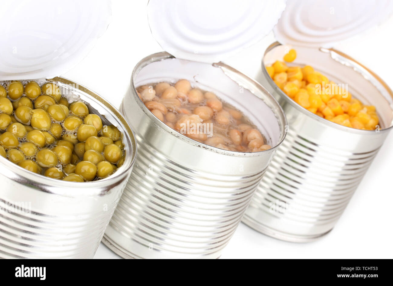Open tin cans of corn, beans and peas isolated on white Stock Photo Alamy