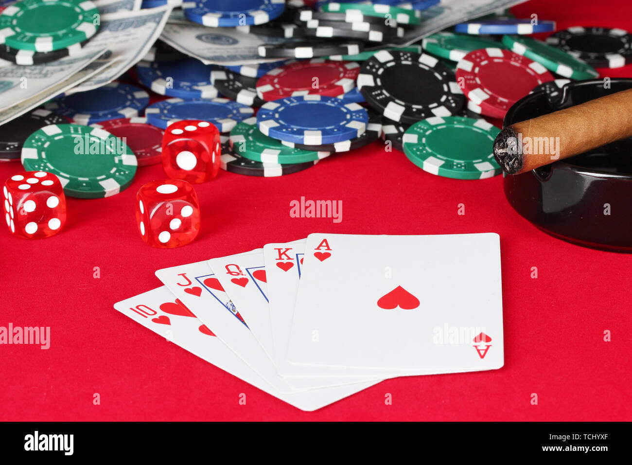 royal flush on a red poker table close-up Stock Photo - Alamy