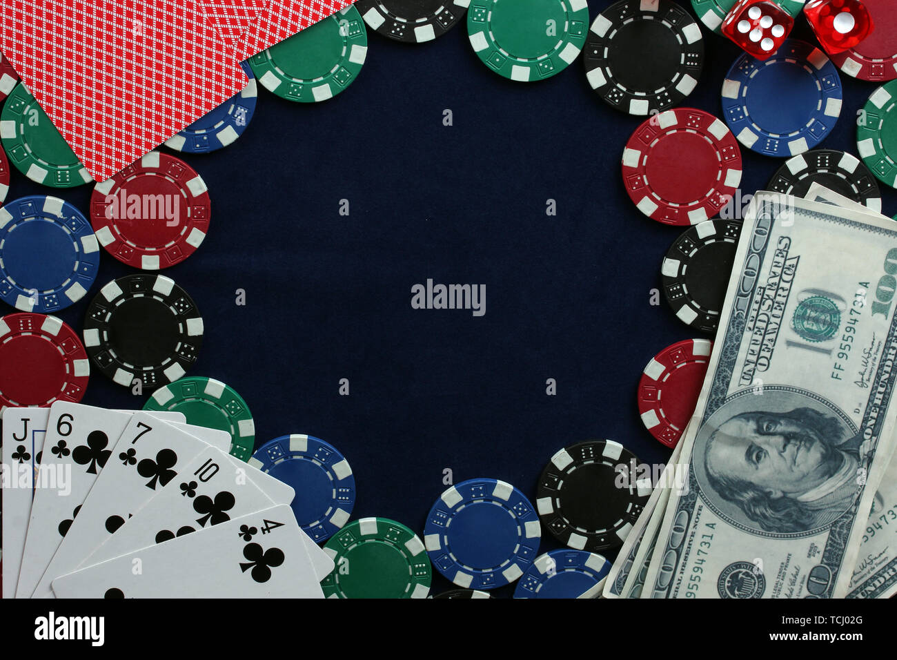 frame made of poker chips, playing cards and dollars on the ...