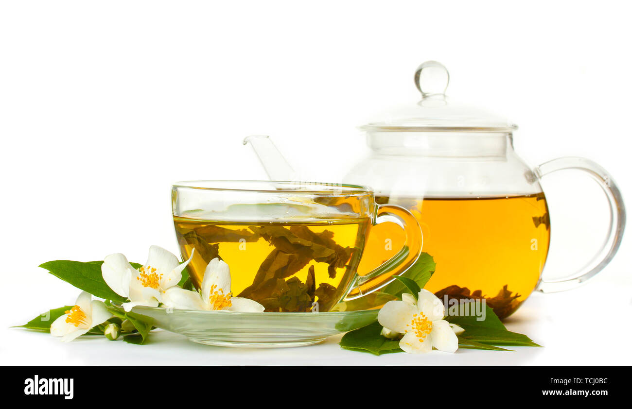 green tea with jasmine in cup and teapot isolated on white Stock Photo