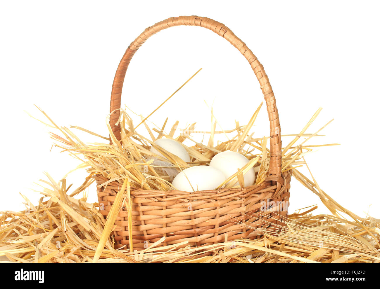 white eggs in a wicker bascet on straw on white background Stock Photo ...