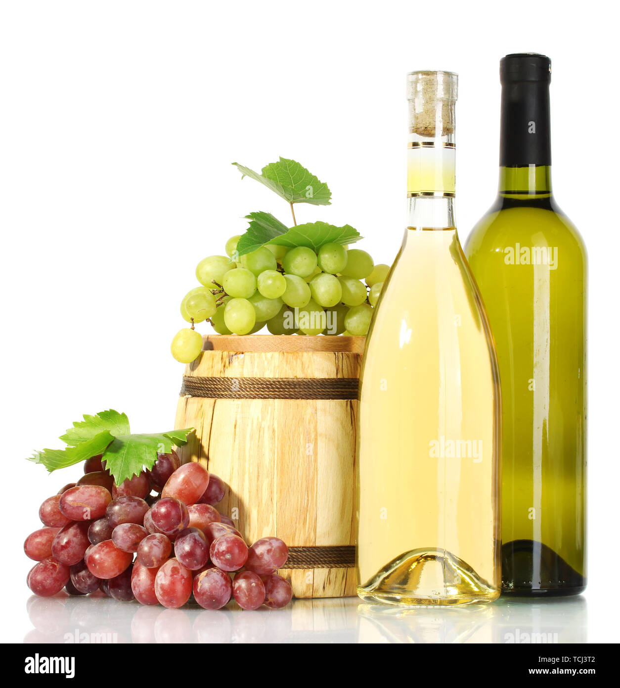 barrel and bottles of wine and ripe grapes isolated on white Stock