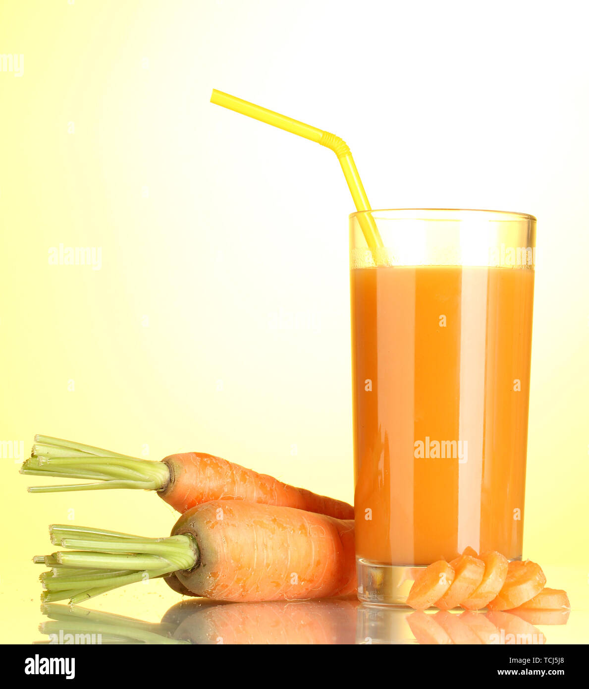 Download Glass Of Carrot Juice On Yellow Background Stock Photo Alamy Yellowimages Mockups