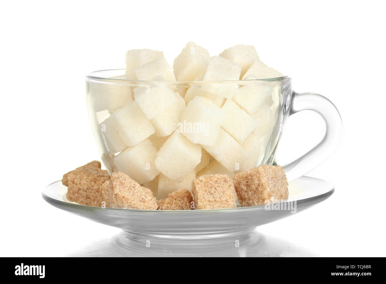 White Refined Sugar And Lump Brown Cane Sugar Cubes In Glass Cup