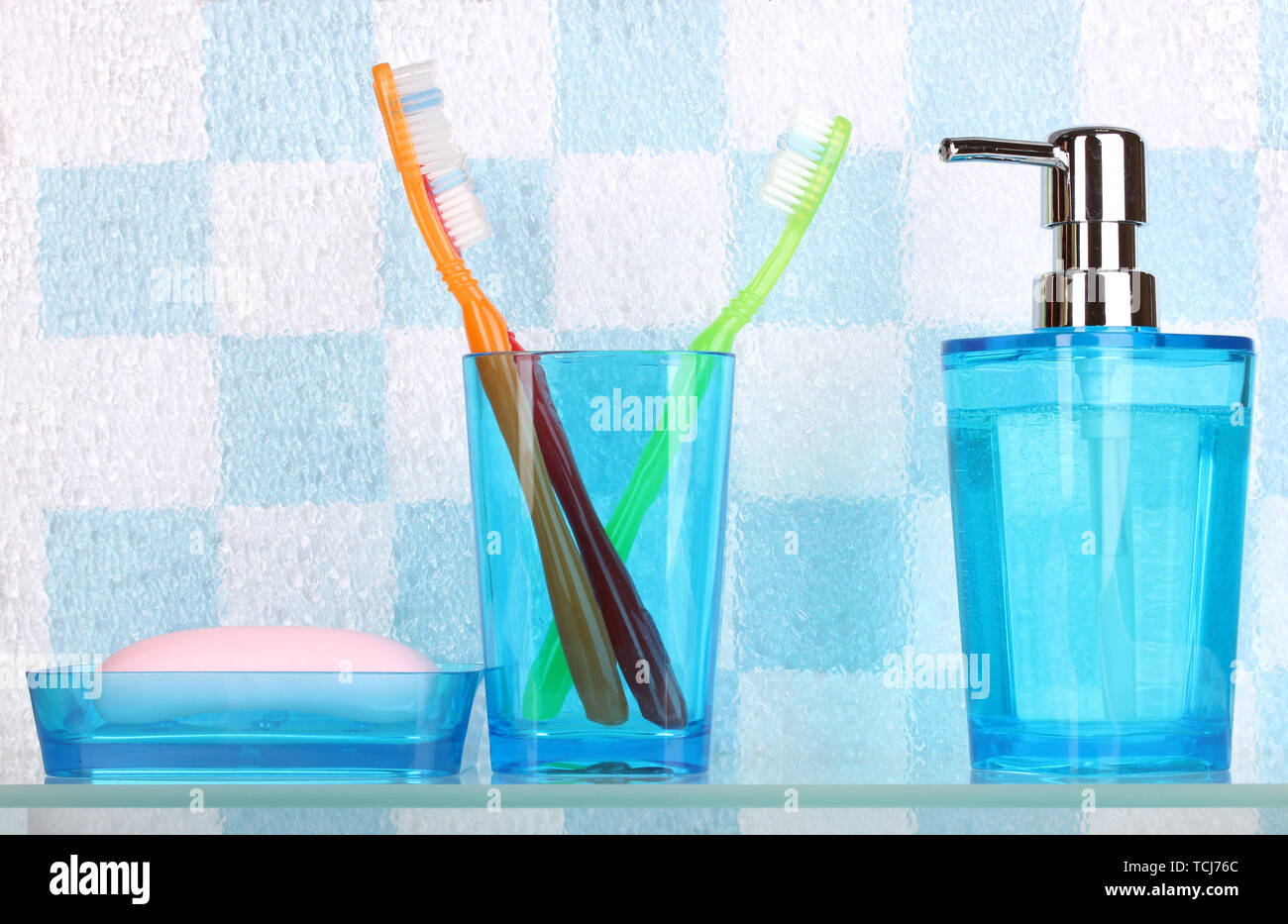 Bath accessories on shelf in bathroom Stock Photo - Alamy