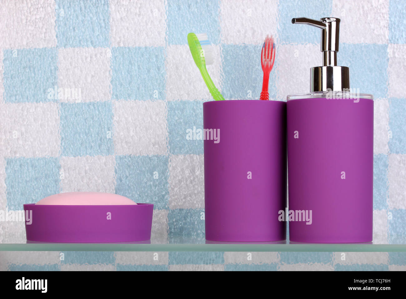 Bath accessories on shelf in bathroom Stock Photo Alamy