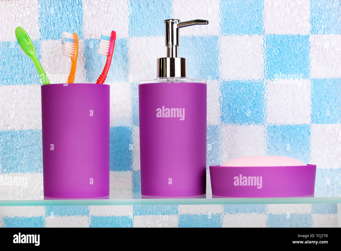 Bath accessories on shelf in bathroom Stock Photo Alamy