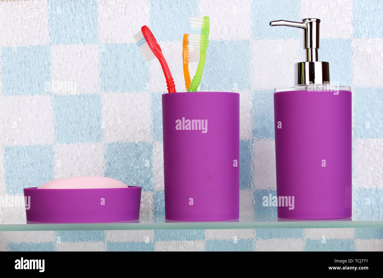 Bath accessories on shelf in bathroom Stock Photo Alamy