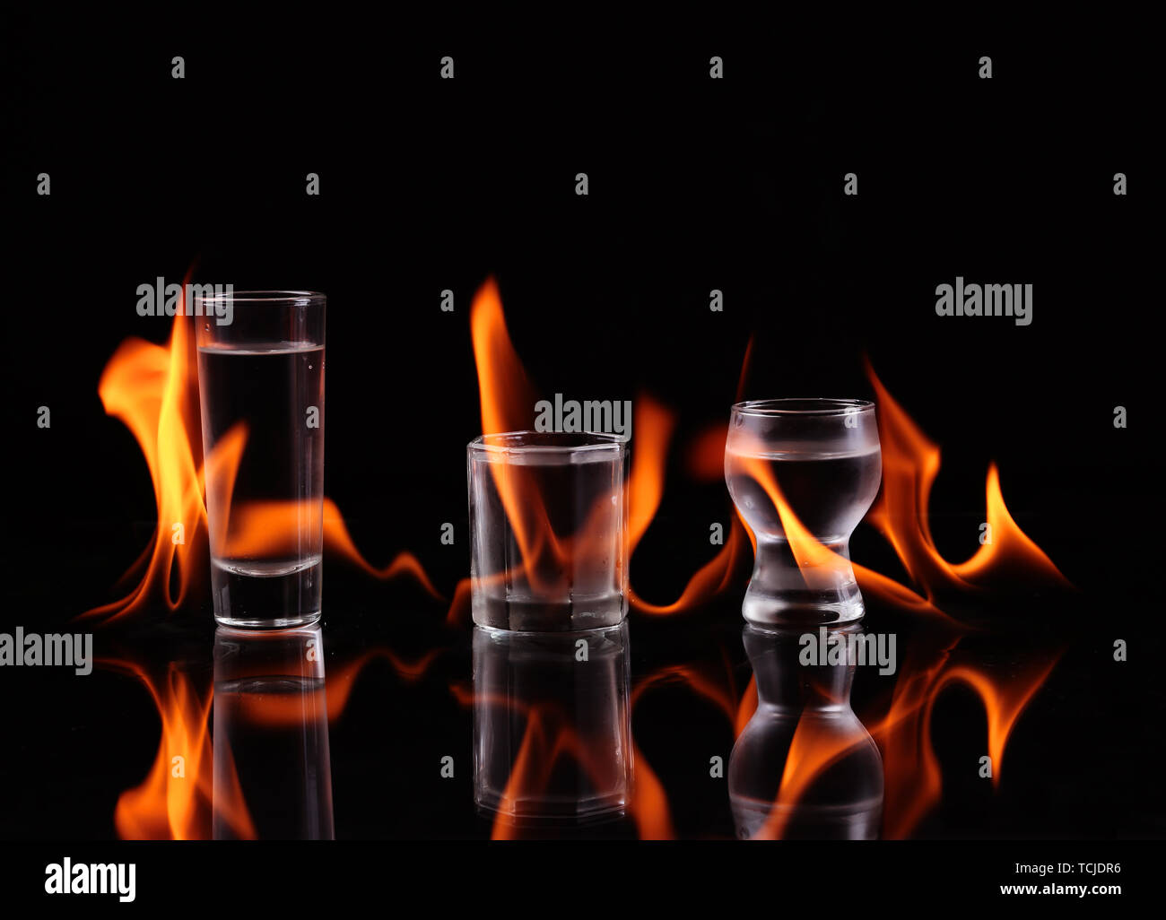 Stack of tequila on fire Stock Photo - Alamy