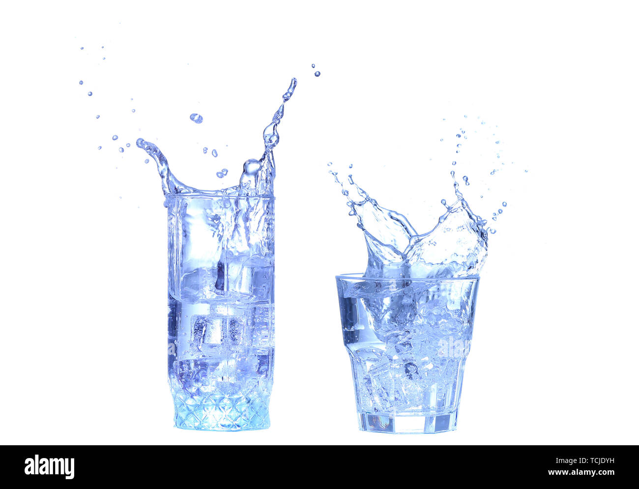 Glass of water, ice and slice of fresh lemon on a white background ...