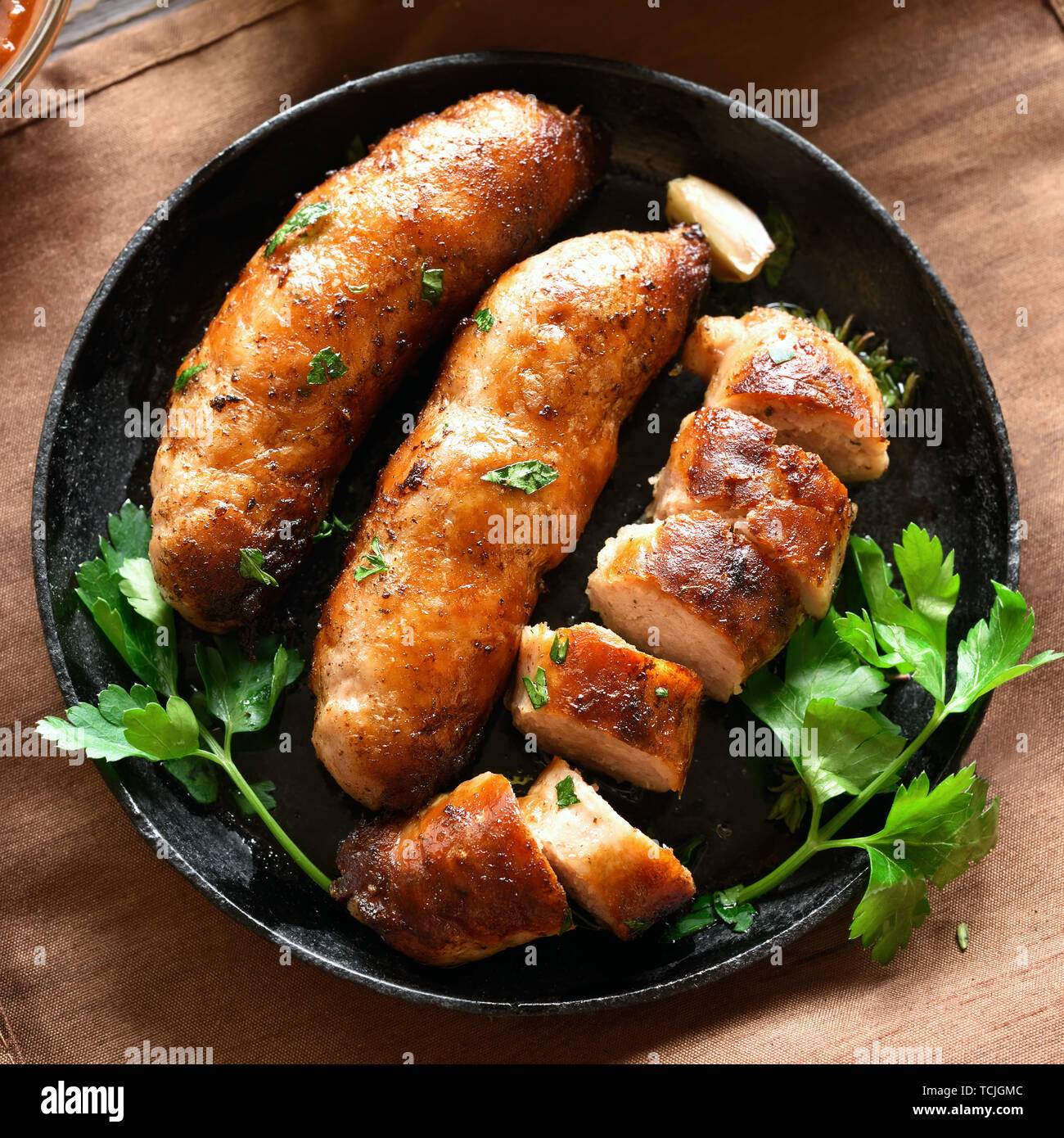 Close up of homemade roasted sausages. Top view, flat lay Stock Photo