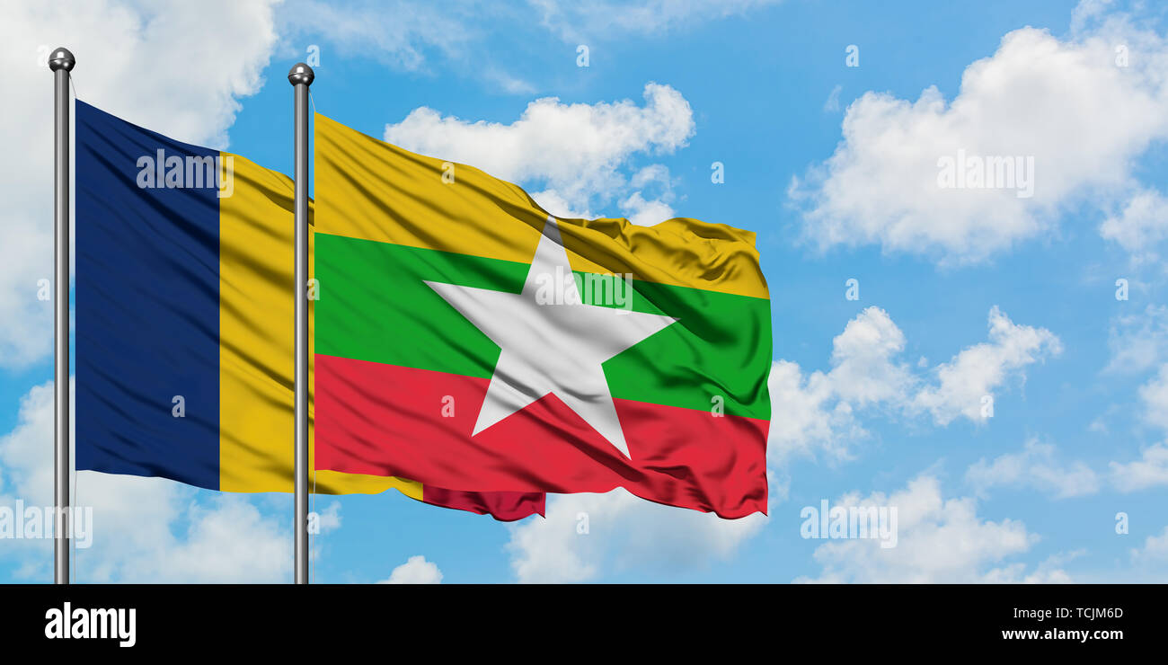 Chad and Myanmar flag waving in the wind against white cloudy blue sky ...