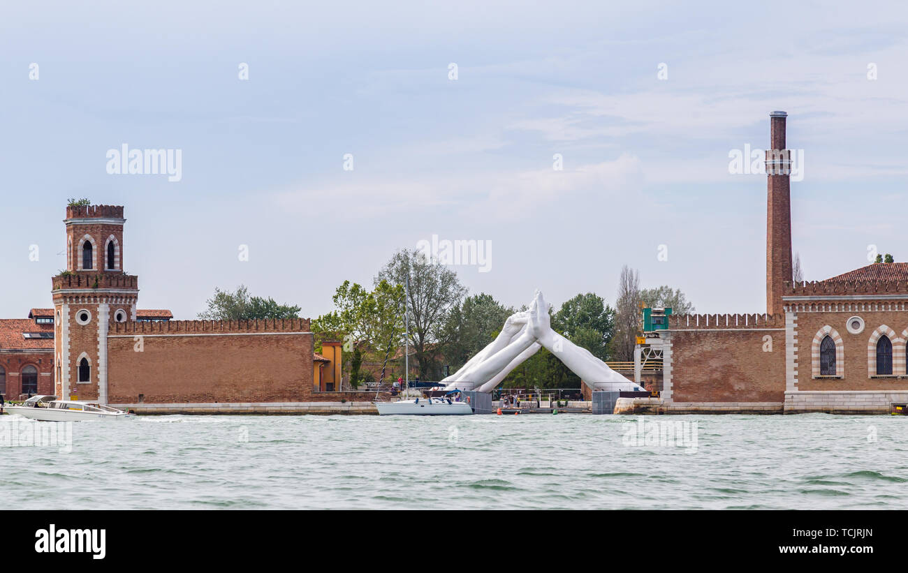 Venice Italy - May 25, 2019: Biennale Arte 2019 Sculpture Building bridges by Lorenzo Quin representing friendship, wisdom, help, faith, hope and love Stock Photo