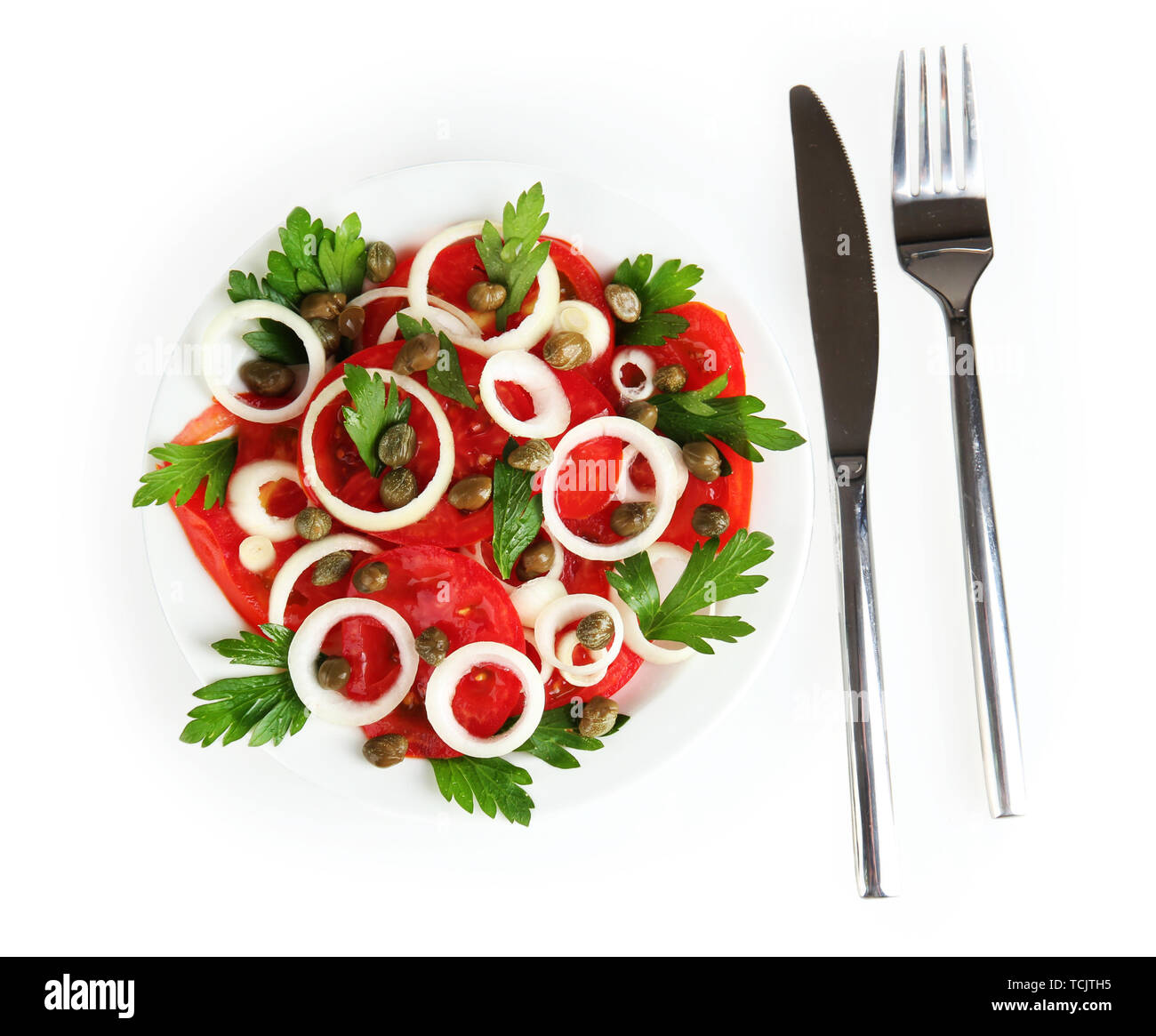 Salad with capers in the plate isolated on white Stock Photo Alamy