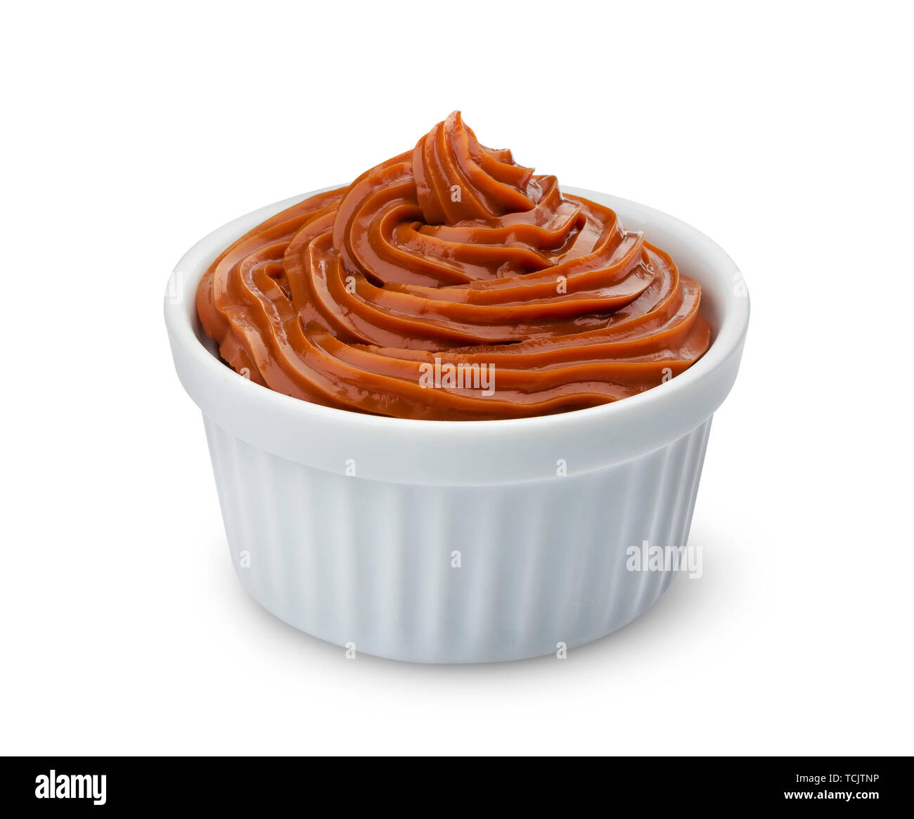 Boiled condensed milk, melted caramel cream isolated on white