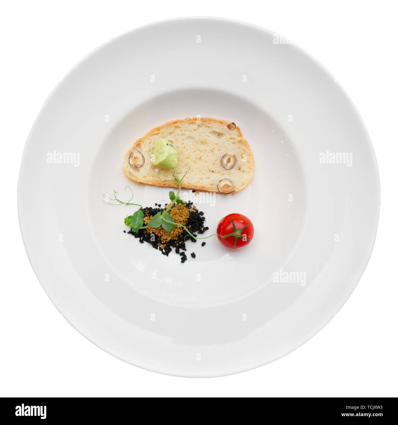 Gourmet dish of ground olives, bread with nuts and tomato, isolated Stock Photo