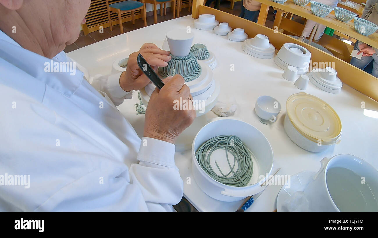 A porcelain maker demonstrates how to make her porcelain goods at her