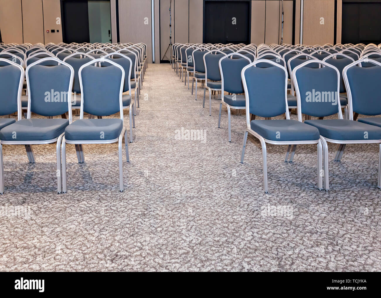 Group of empty blue chairs in modern conference hall - presentation room for seminars Stock Photo