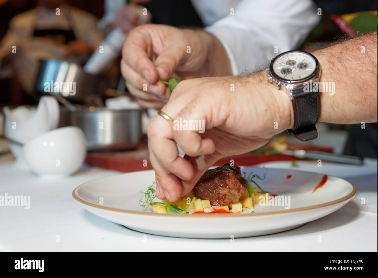 Chef is cooking an elegant meat dish Stock Photo