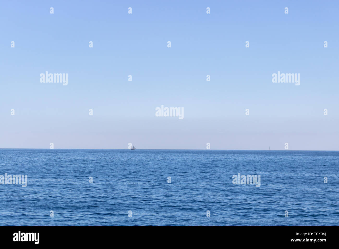Seascape with sea horizon and almost clear deep blue sky Stock Photo ...