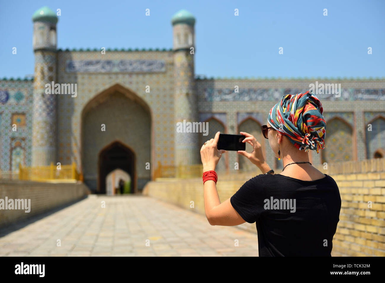 Tourist admiring the Khudayar Khan Palace, the most popular landmarks