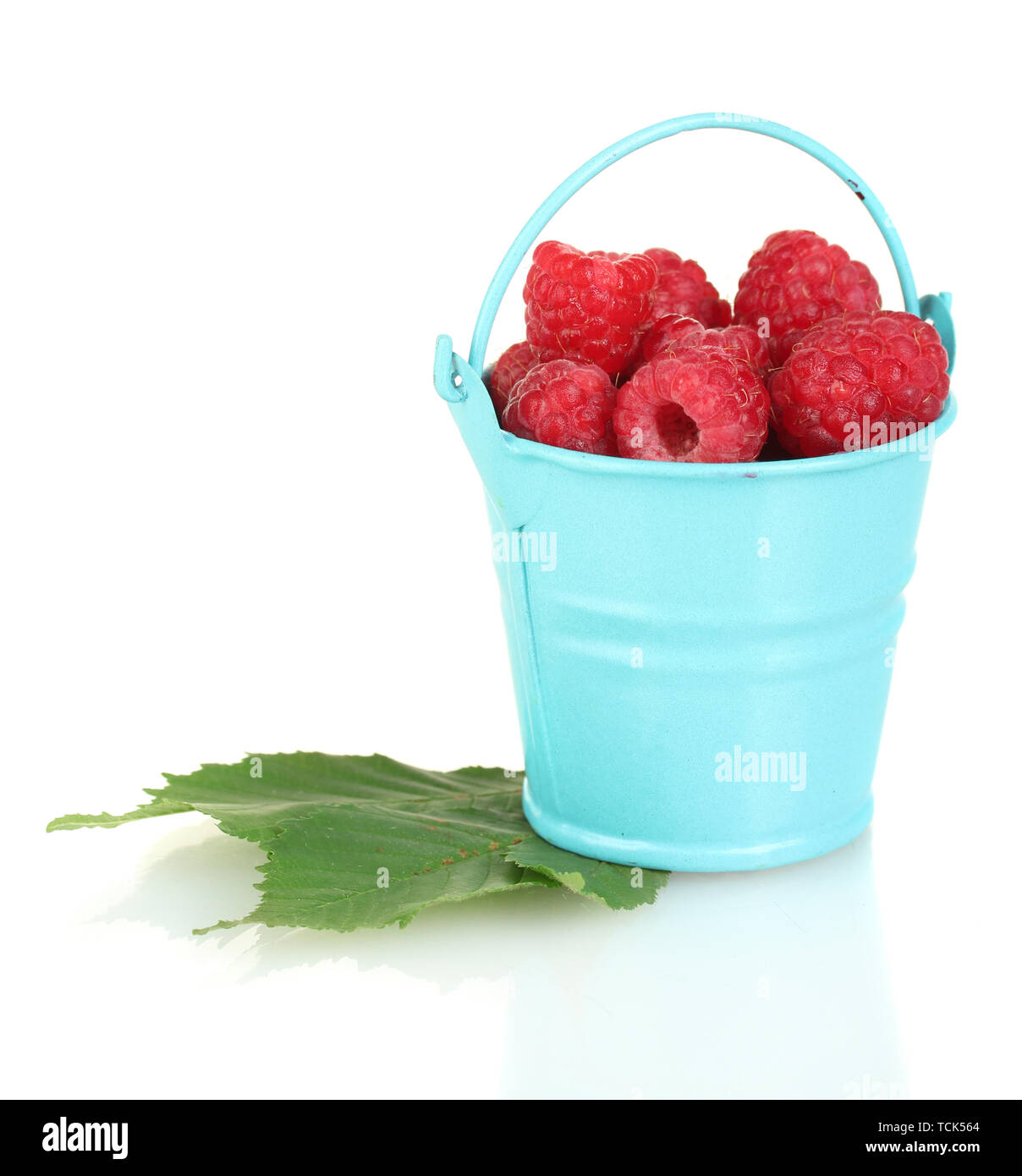 Fresh raspberries in blue bucket isolated on white Stock Photo - Alamy