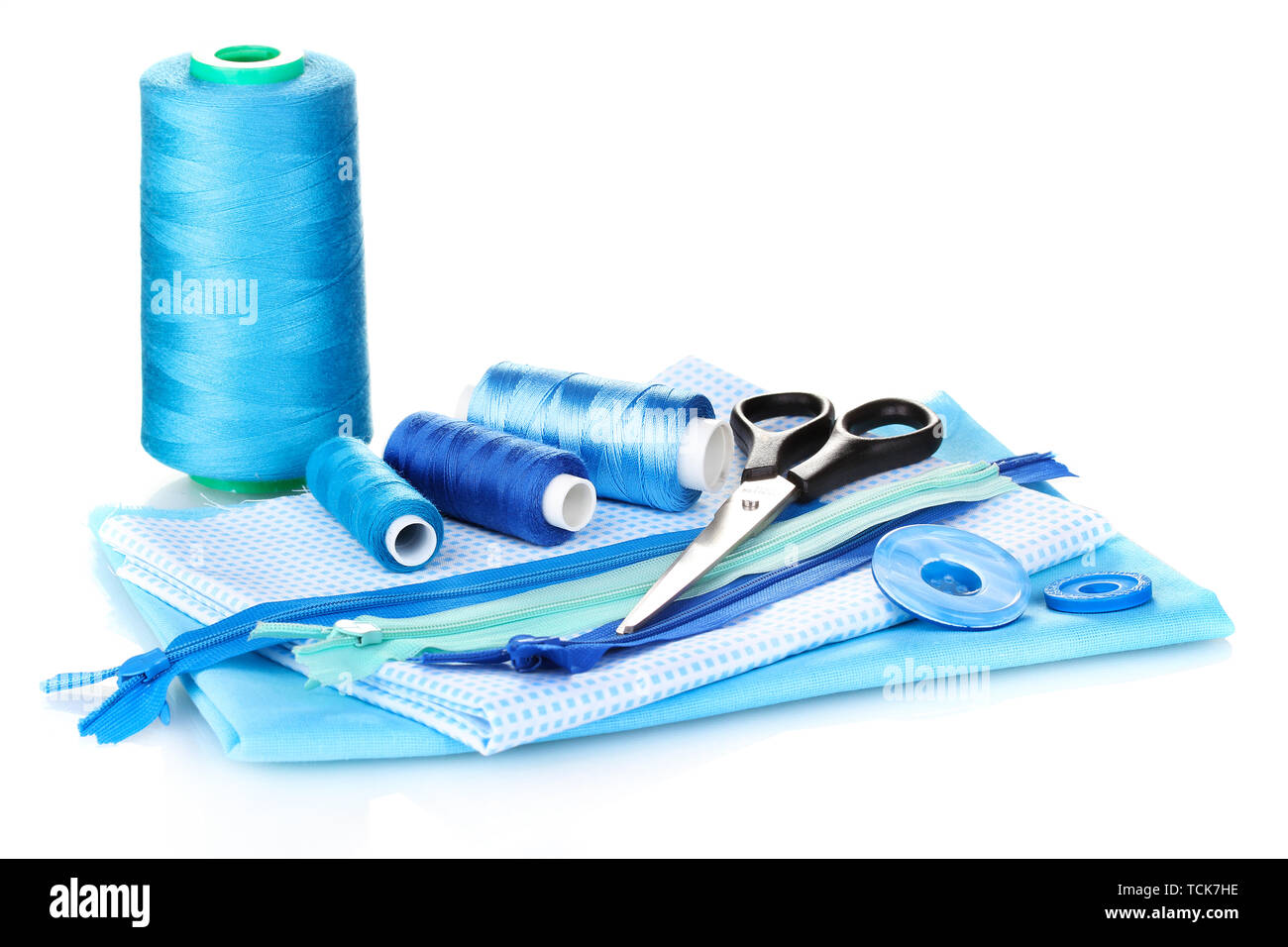 Sewing accessories and fabric isolated on white Stock Photo - Alamy