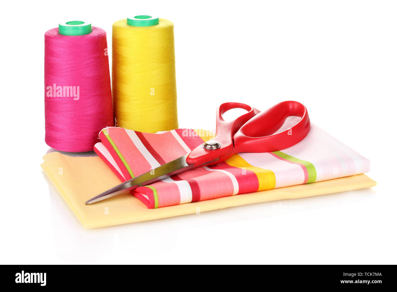 Sewing accessories and fabric isolated on white Stock Photo - Alamy