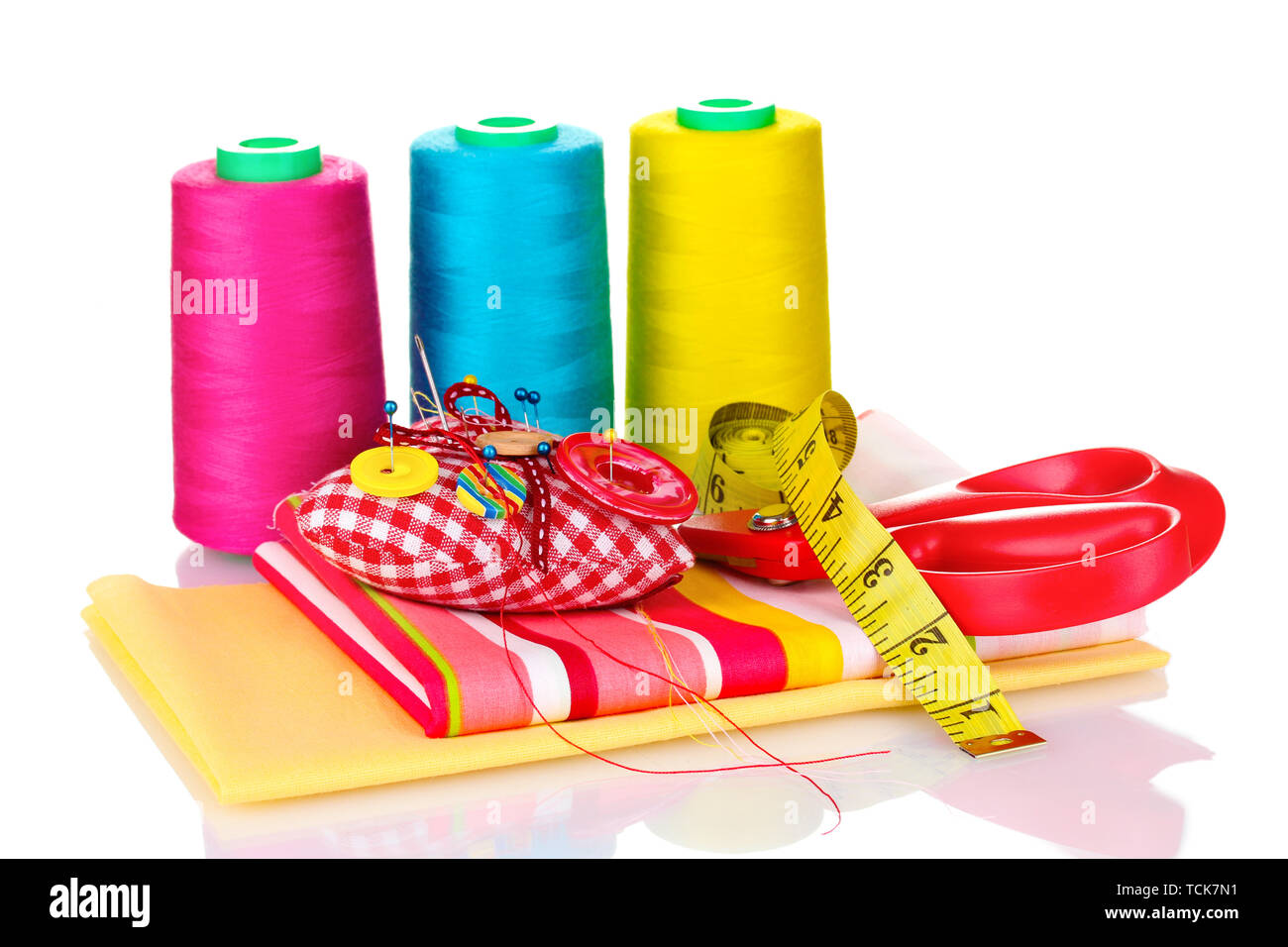Sewing accessories and fabric isolated on white Stock Photo - Alamy