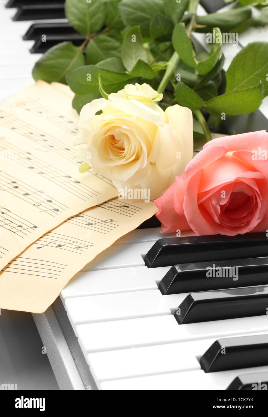 background of piano keyboard with roses Stock Photo - Alamy