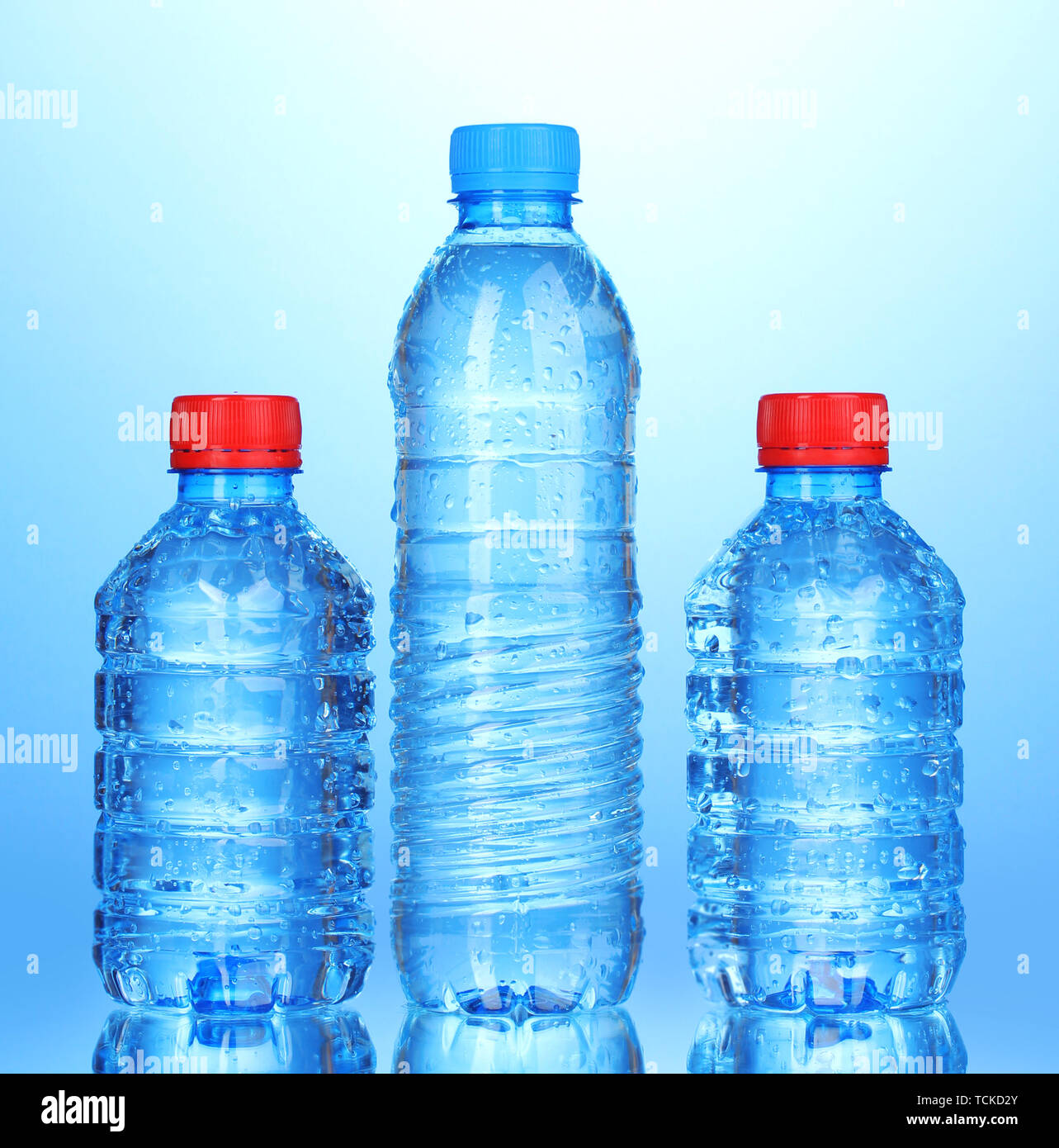Download Plastic Bottles Of Water On Blue Background Stock Photo Alamy PSD Mockup Templates