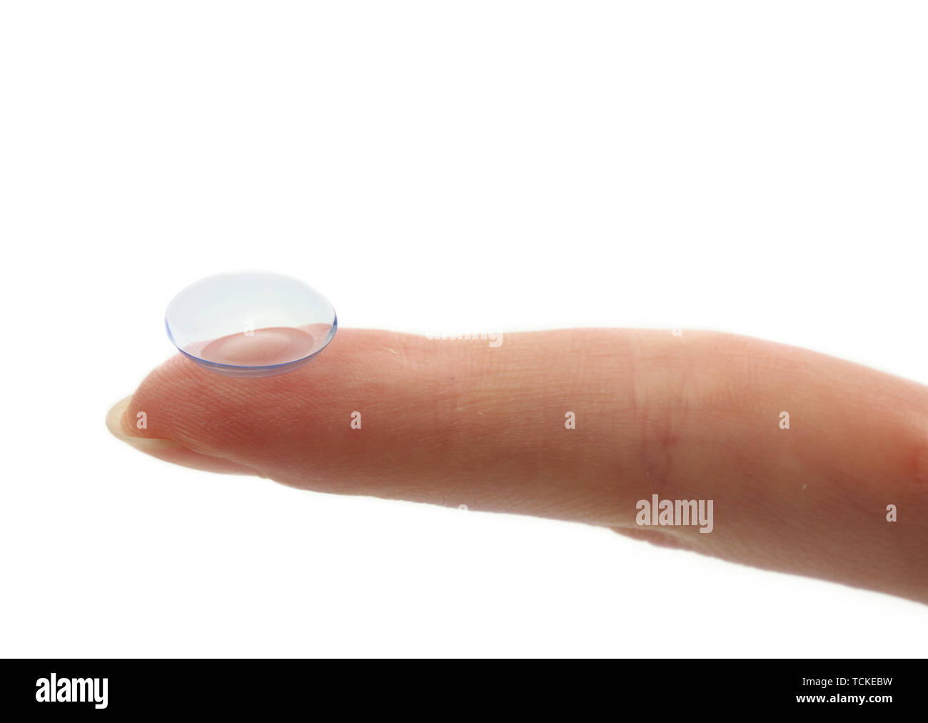 contact lens on finger isolated on white Stock Photo