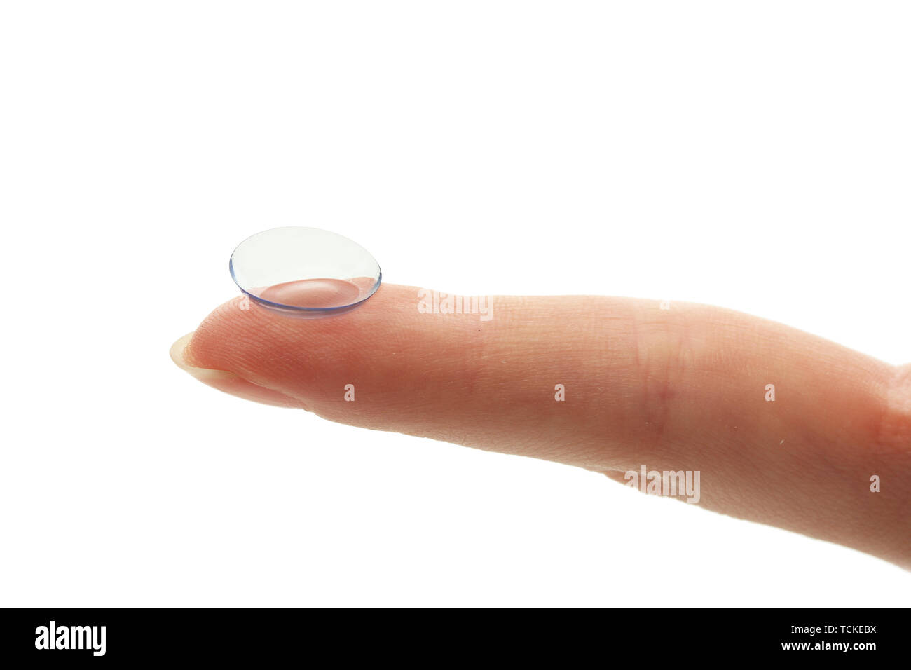 contact lens on finger isolated on white Stock Photo